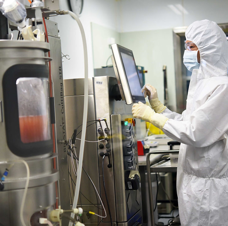 Operator at the bioreactor control station during process scale-up