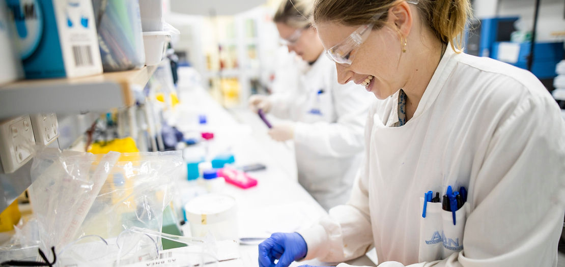 Researchers in vaccine lab
