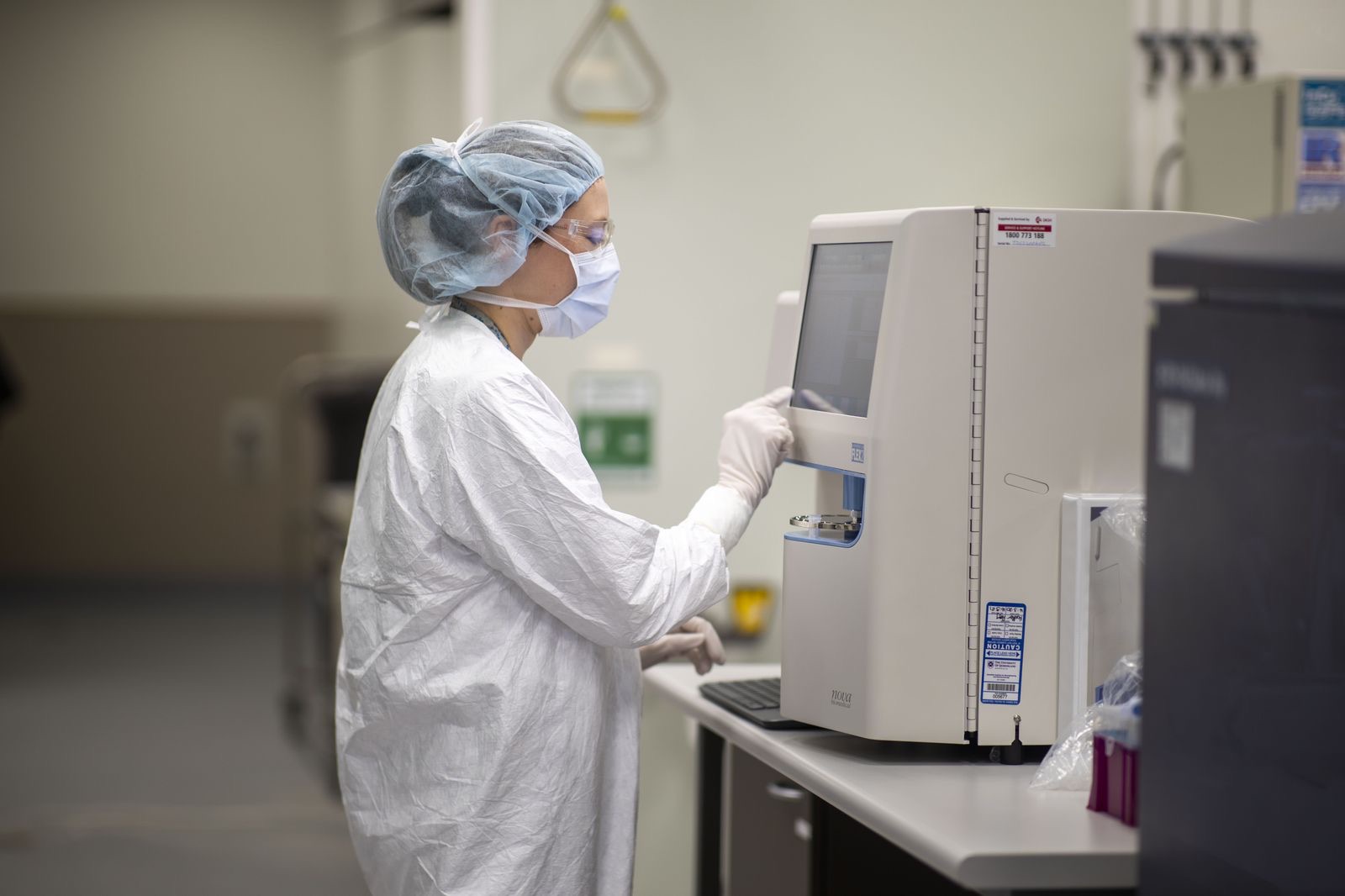 NBF scientist operating a benchtop analyser during quality control release testing